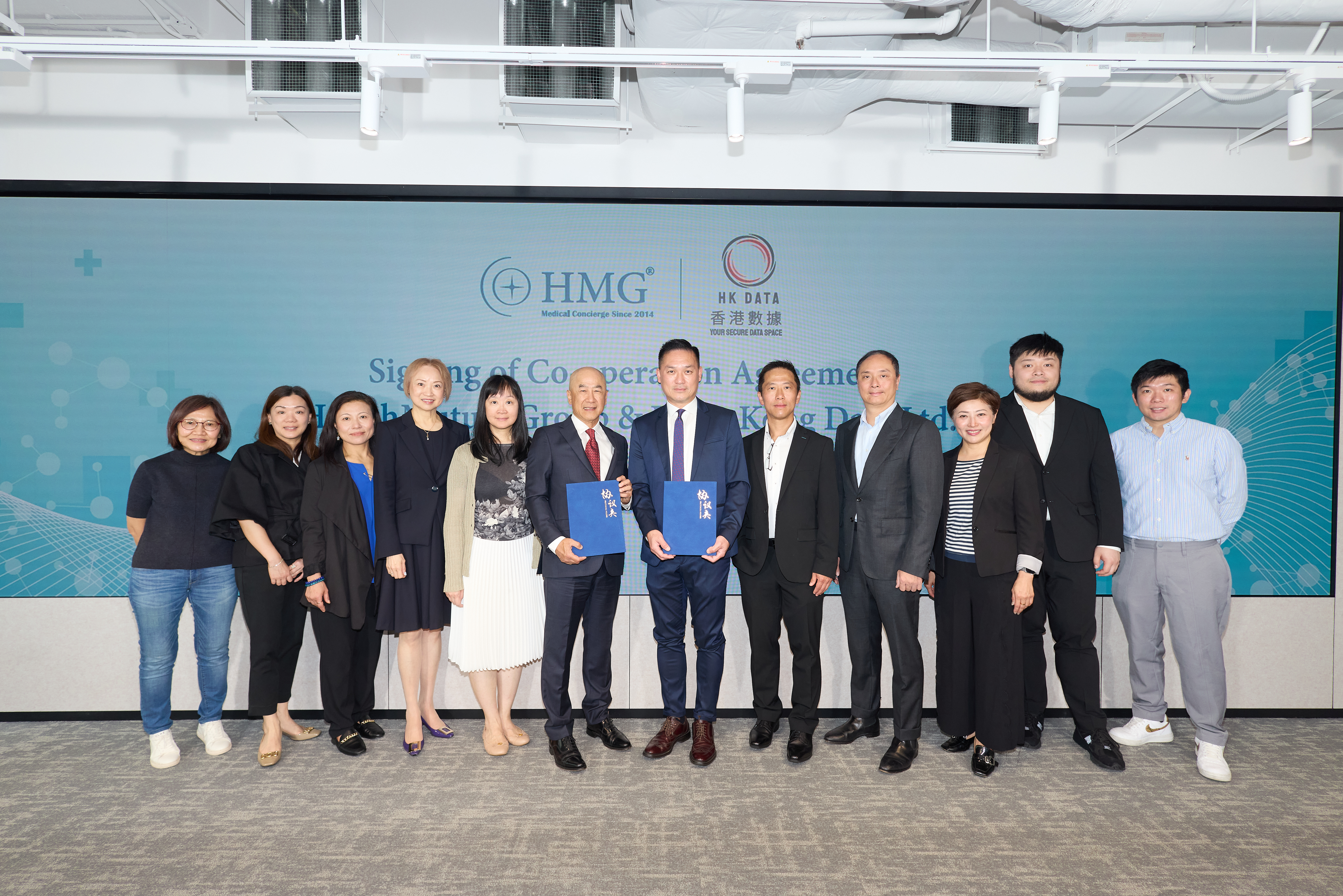 Distinguished guests witness the signing ceremony